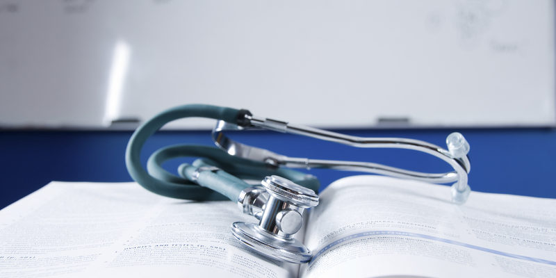 Healthcare health care concept with a medical book